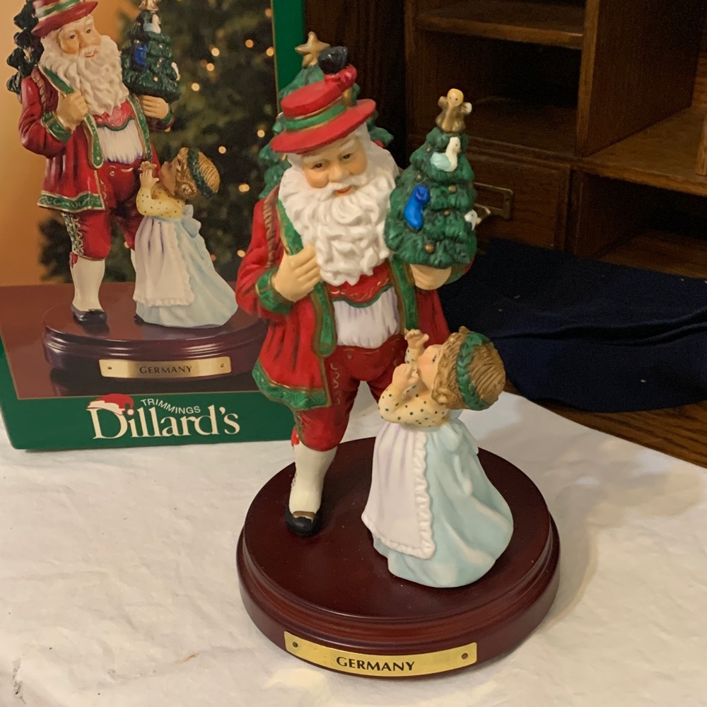 Dillard's Festive Santa and Child musical Figurine - mostly Red and Green